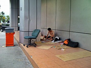 A temporary home, in plain sight of corporate offices. Yet urban society ignores the homeless, maybe hoping they would simply disappear.